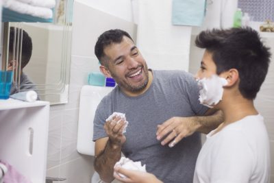 Father teaches son how to start shaving