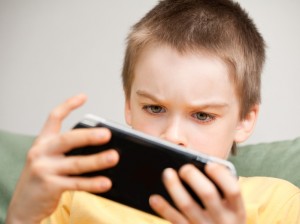 Boy playing game console